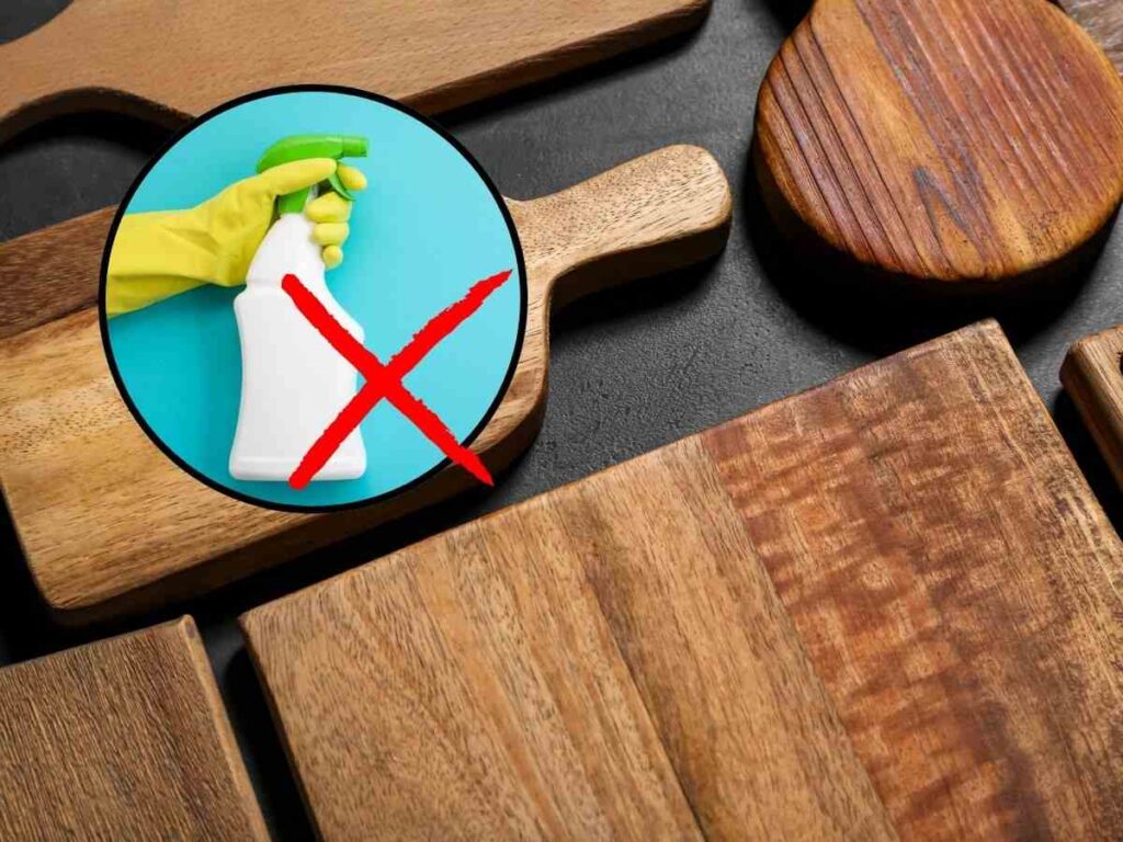 sfondo taglieri di legno e tondo con mano con spray e X rossa